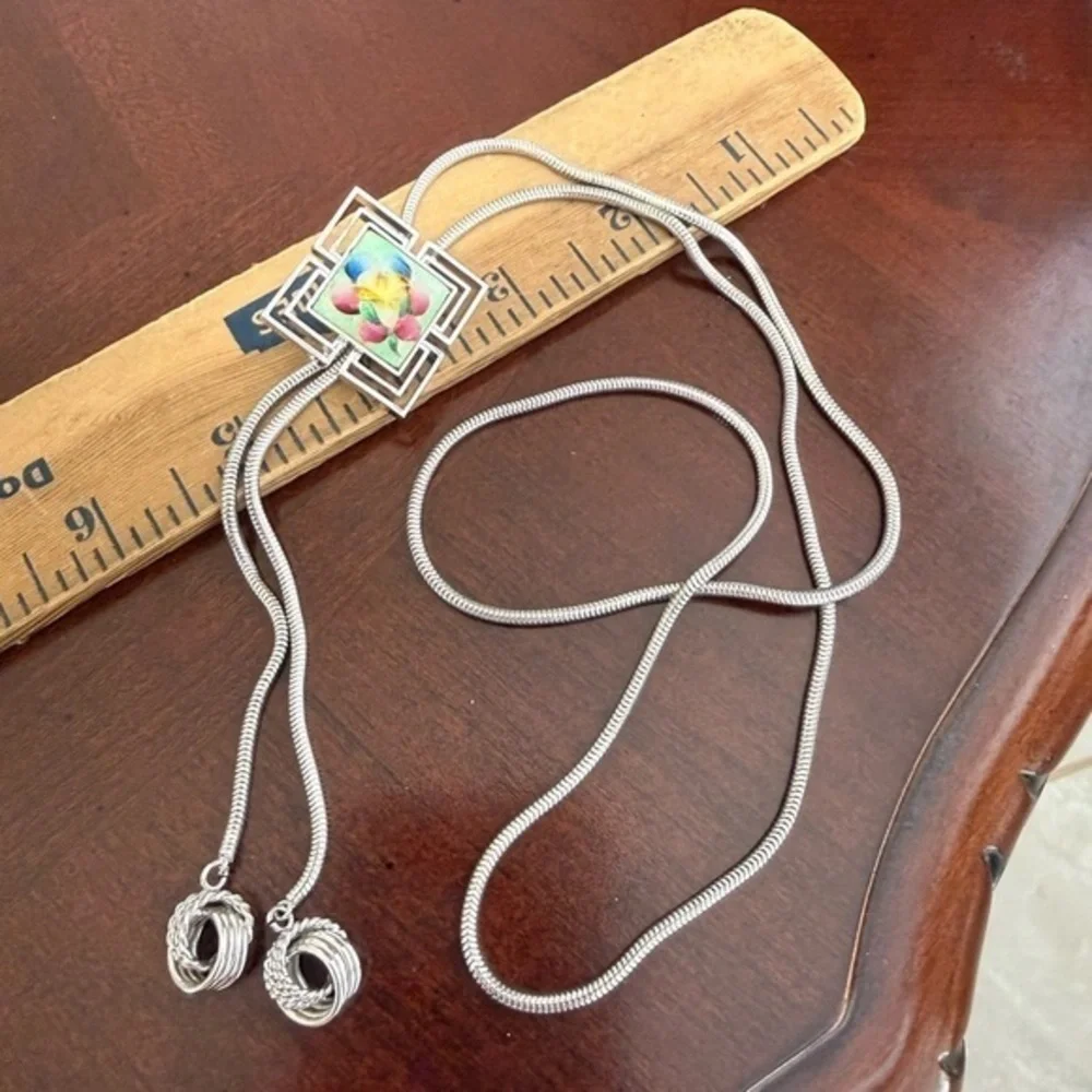 Pat Silver Tone Necklace